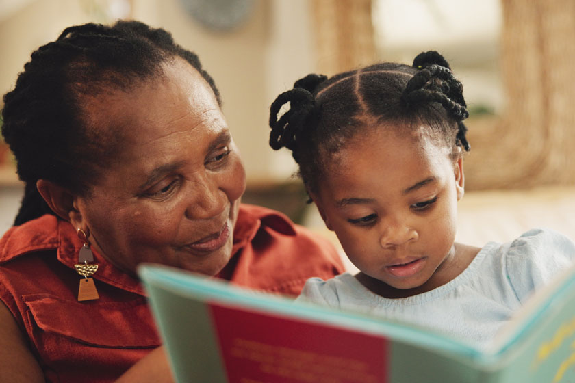 Grandmother and child with book