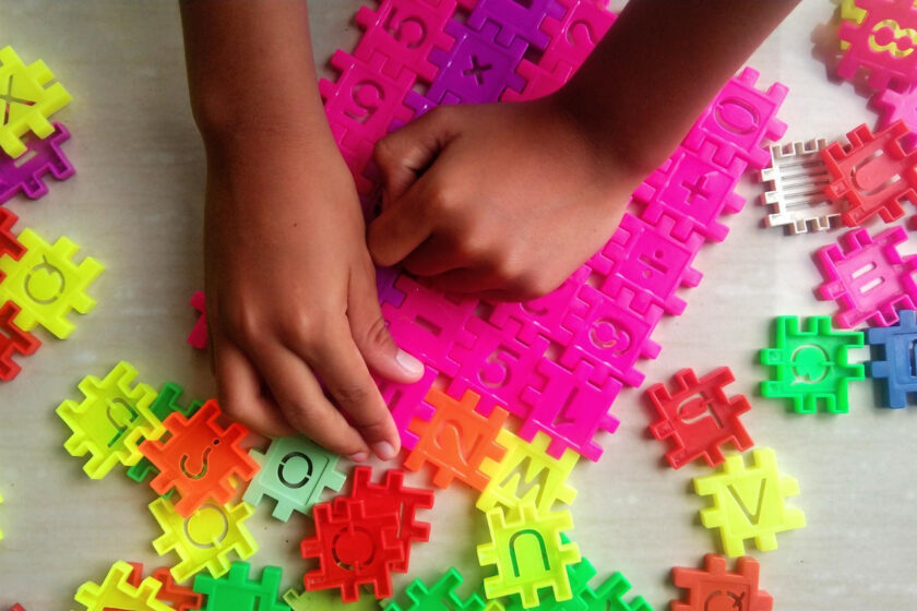 High angle view of girl playing with toy